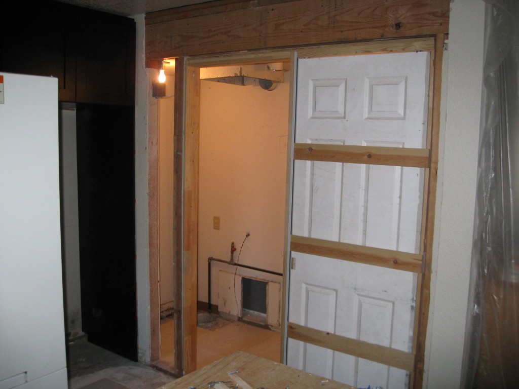 My new large, combined closet is in place!  Here you can see the single entrance pocket door that was installed yesterday.